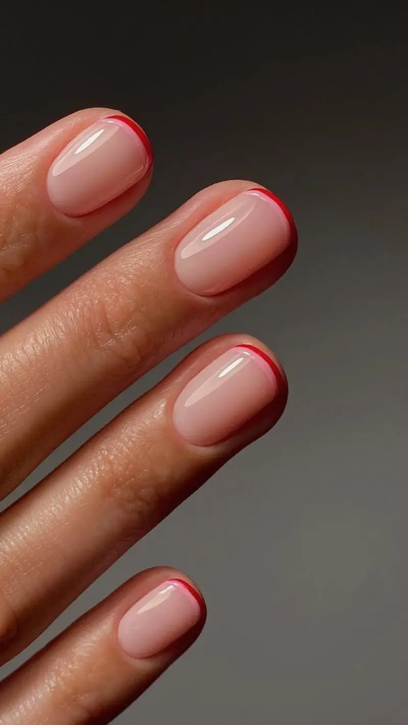 Red micro French tip nails on short nails